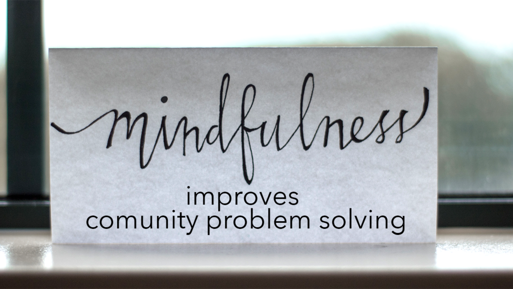 Mindfulness improves community problem solving